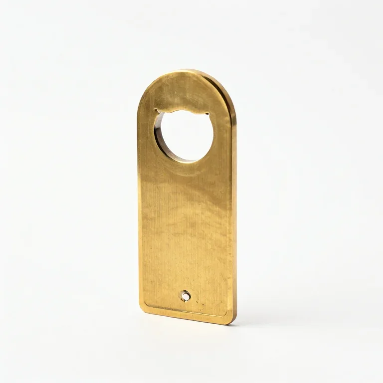 a brass letter opener, side view, single item fully visible and centred, isolated on a pure w...
