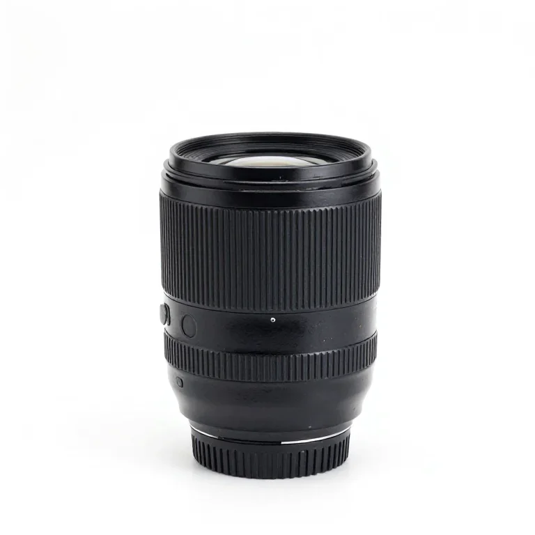 a camera lens standing upright, three-quarter view, single item fully visible and centred, is...