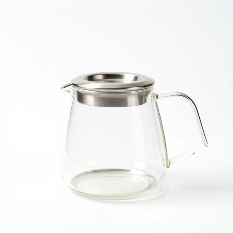 a glass electric kettle with a steel collar, three-quarter view, single item fully visible an...
