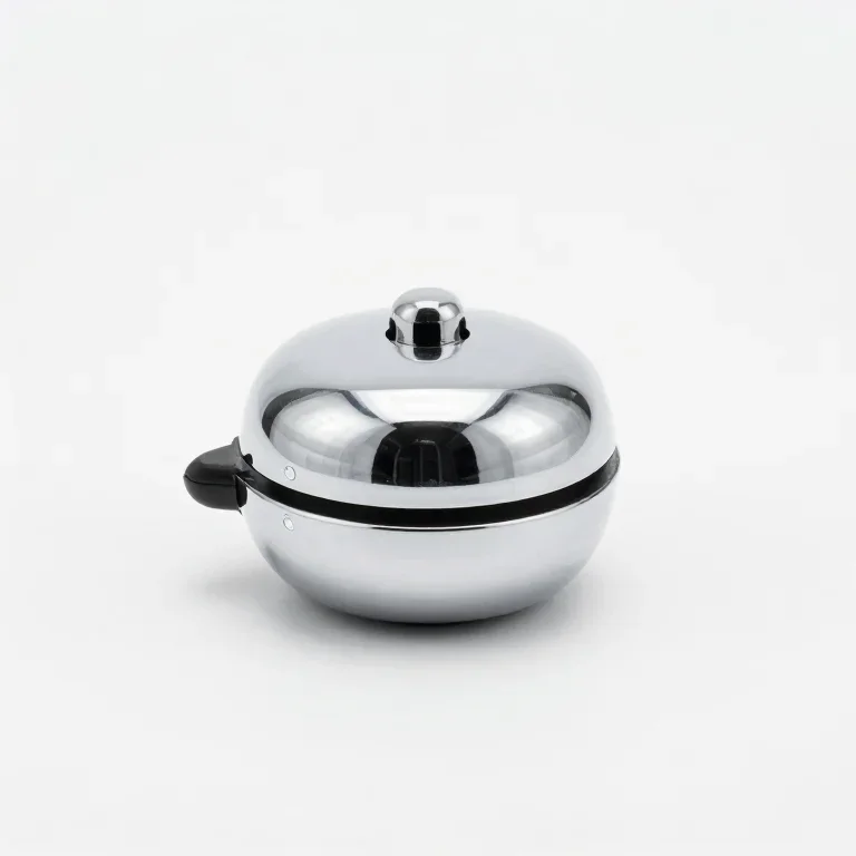 a polished chrome bicycle bell, front view, single item fully visible and centred, isolated o...