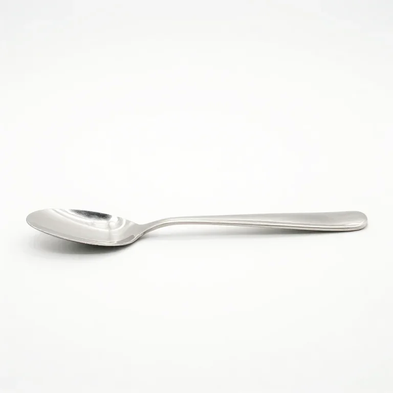 a polished steel butter spreader, side view, single item fully visible and centred, isolated...