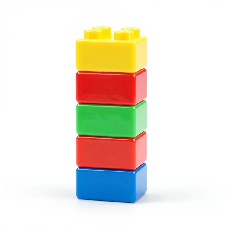 a stack of four toy building blocks in primary colours, moulded plastic, front view, single i...