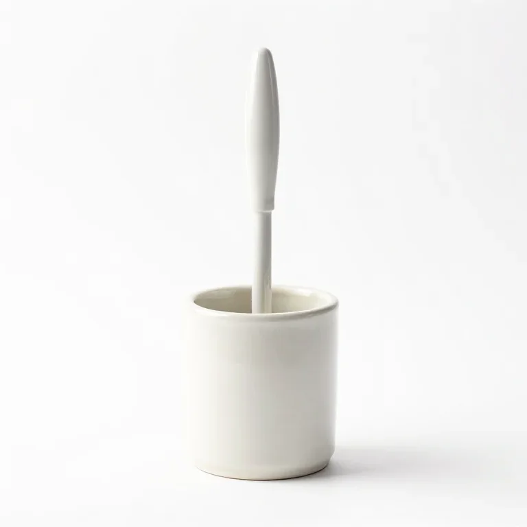 a toilet brush in a ceramic holder, three-quarter view, single item fully visible and centred...