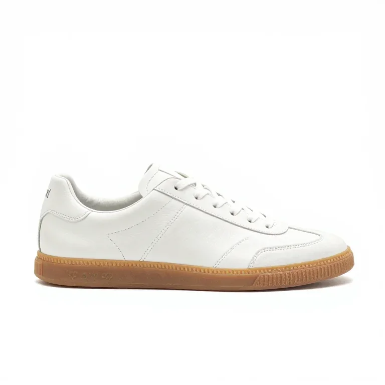 a white leather sneaker with a gum sole, side view, single item fully visible and centred, is...