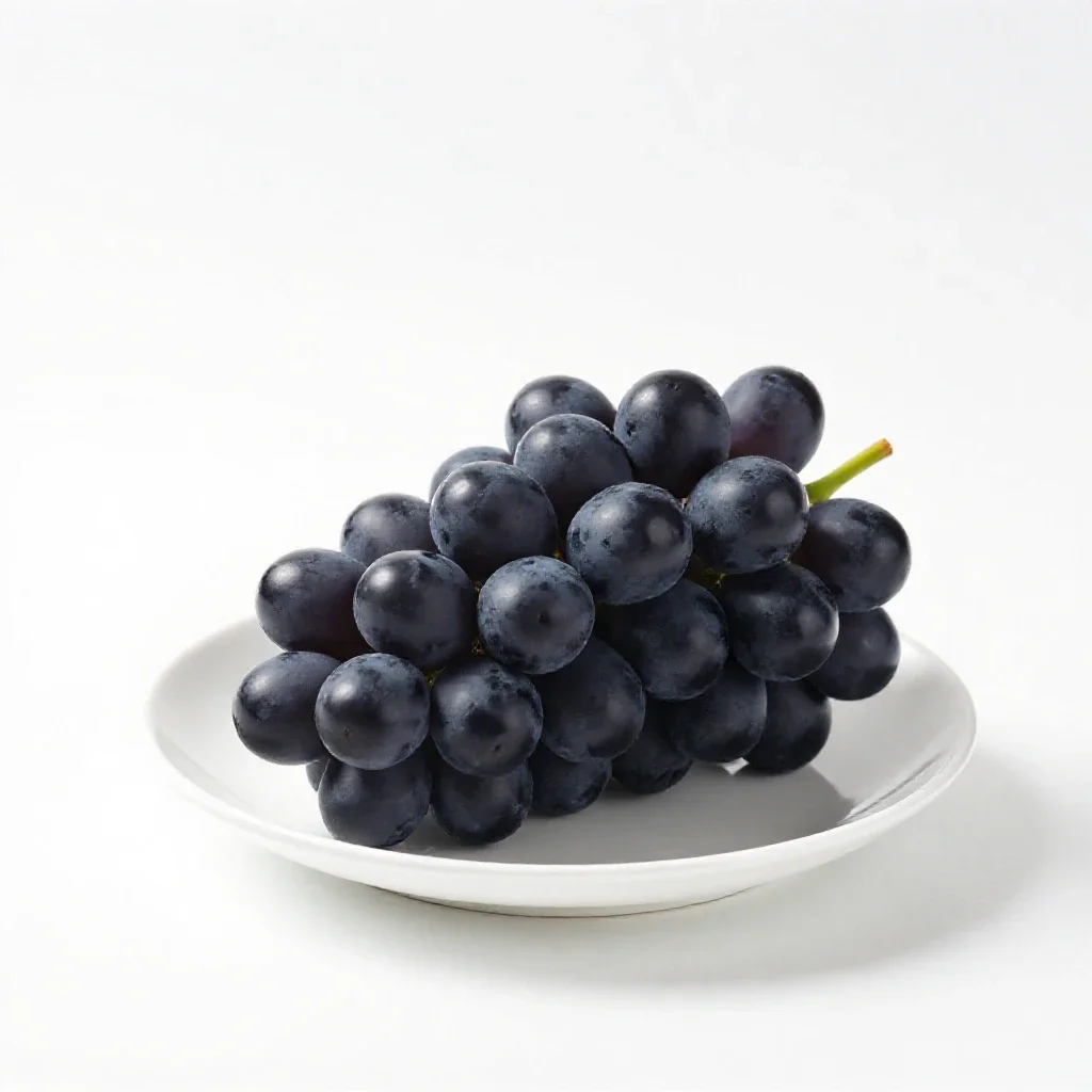 Bunch of black grapes isolated on a white background
