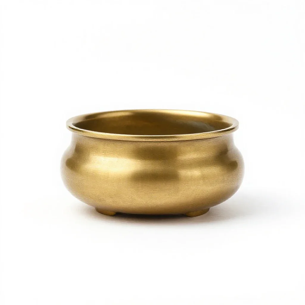 Brass incense burner isolated on a white background