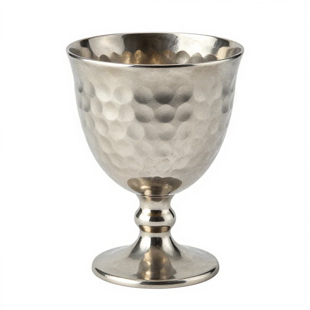 Goblet of hammered silver isolated on a white background