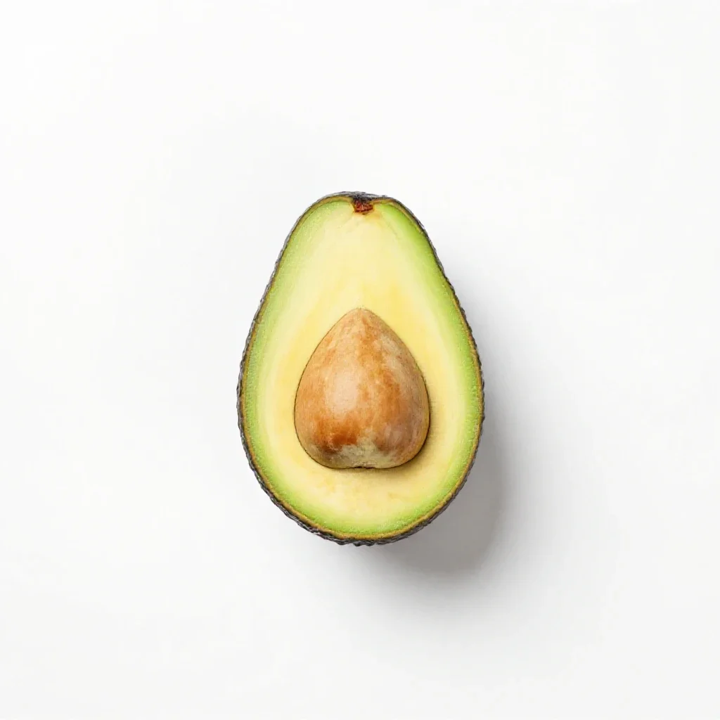 Avocado halved with the stone isolated on a white background
