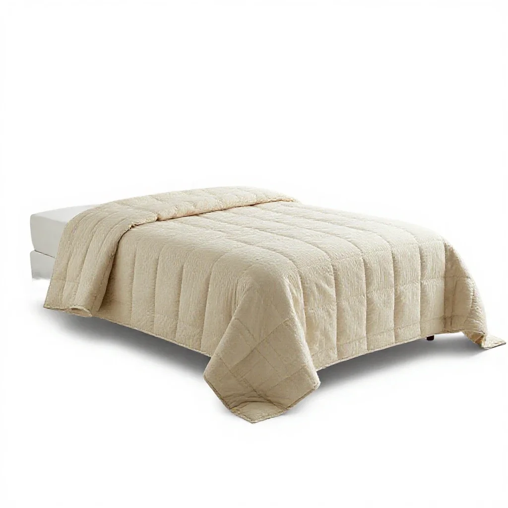 Quilted bedspread isolated on a white background