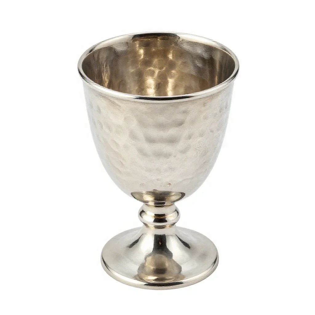Goblet of hammered silver isolated on a white background