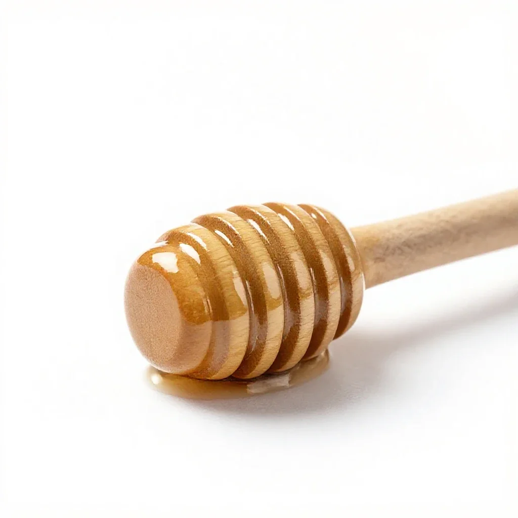 Honey dipper isolated on a white background