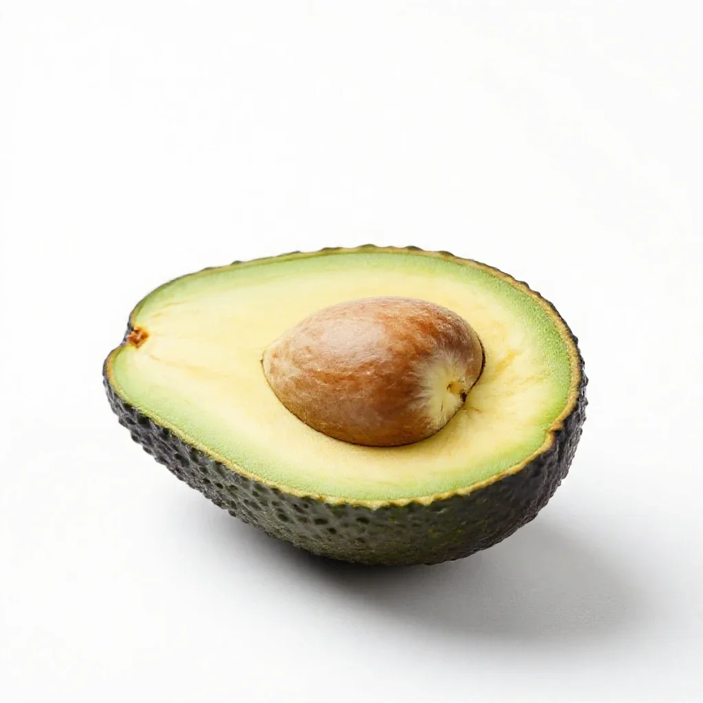 Avocado halved with the stone isolated on a white background