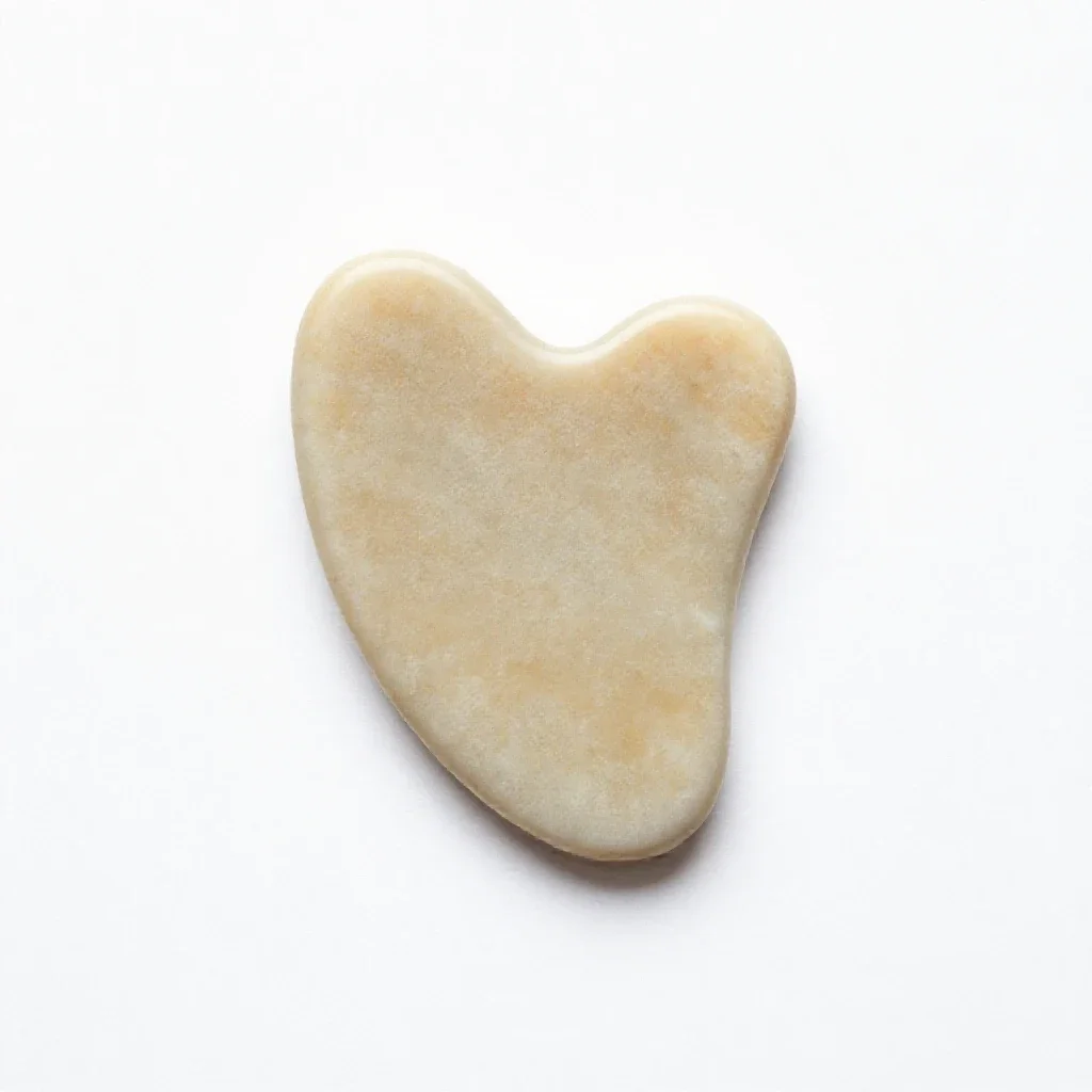 Gua sha stone isolated on a white background