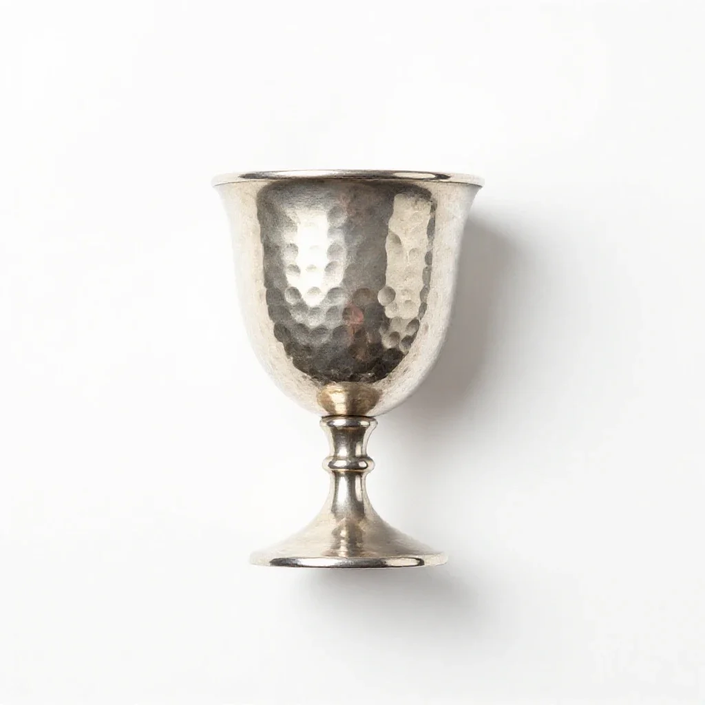 Goblet of hammered silver isolated on a white background