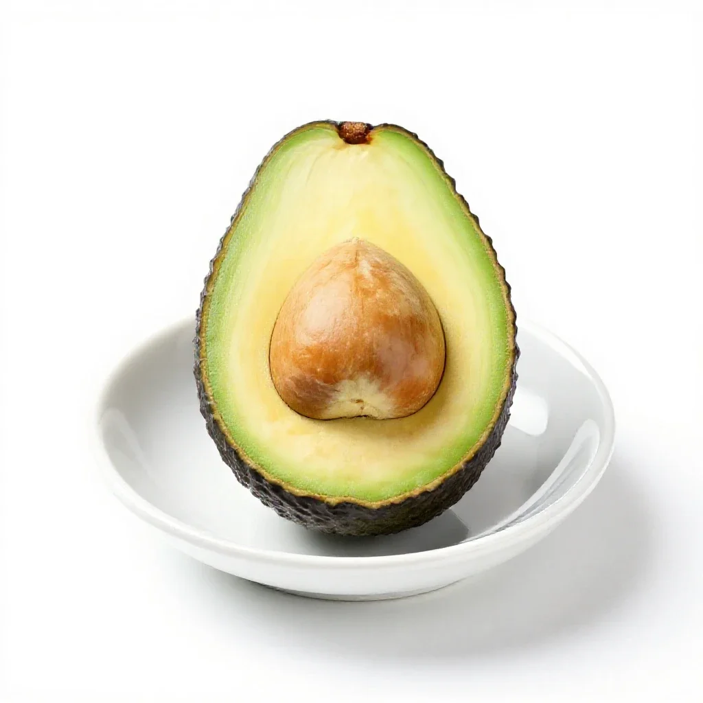 Avocado halved with the stone isolated on a white background