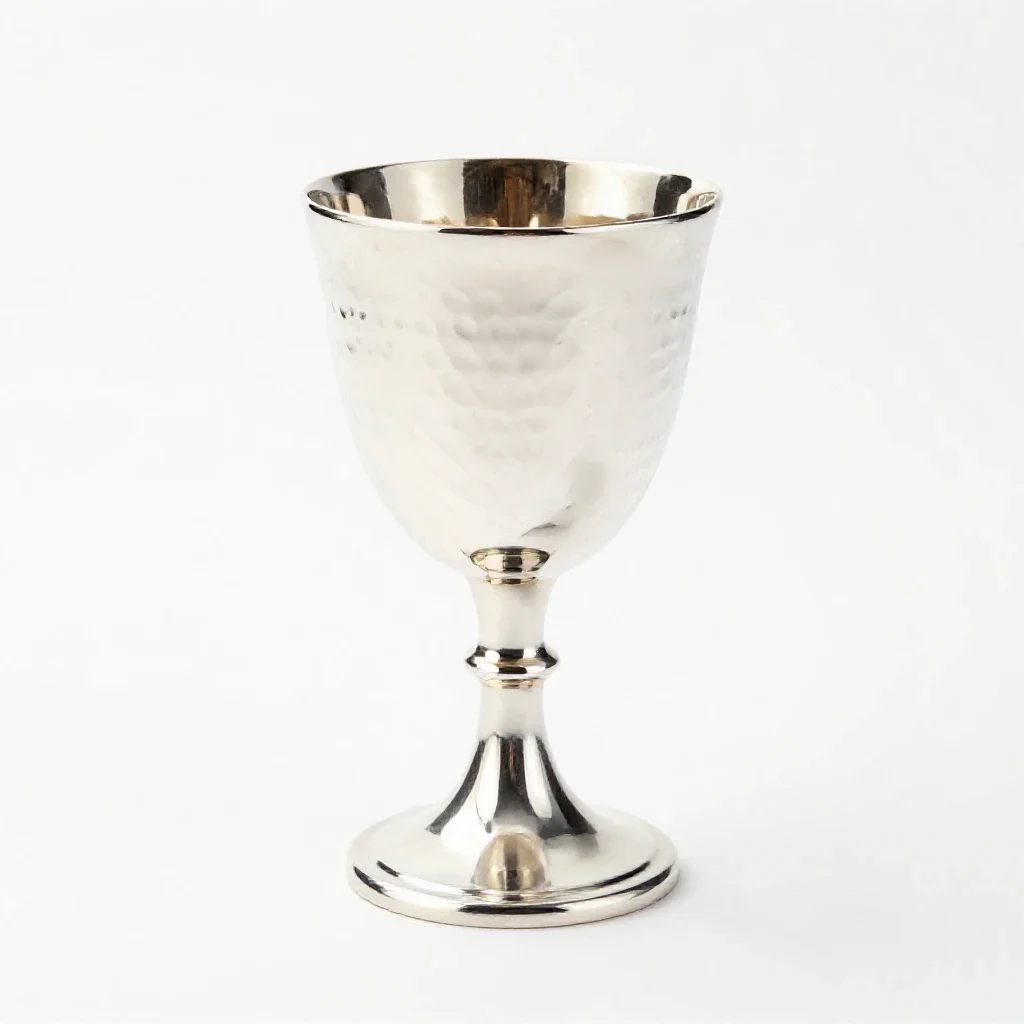 Goblet of hammered silver isolated on a white background