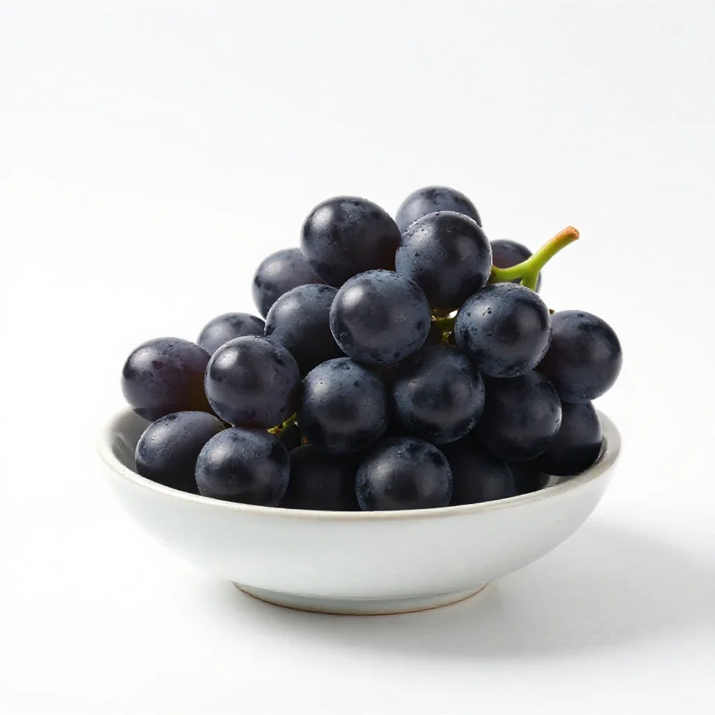 Bunch of black grapes isolated on a white background