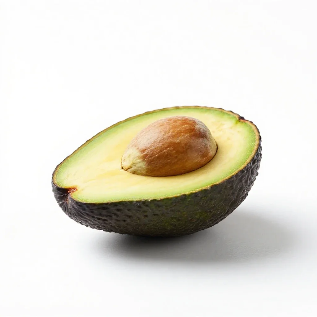 Avocado halved with the stone isolated on a white background