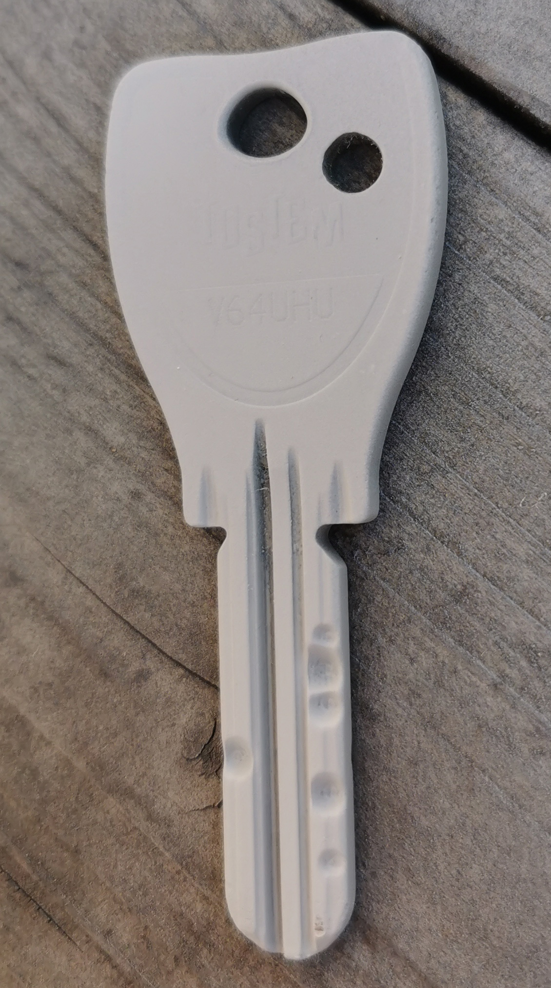 a mat finished key with divots on the blade
