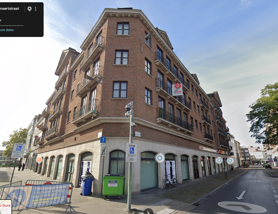 cartoony style of Beglian multi story house, no sidewalk, no signs, no light poles, just the building