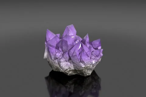 Cluster of amethyst crystals on a black surface 3D model preview