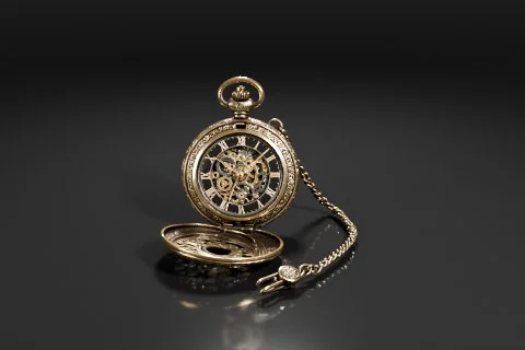 Gold pocket watch with a chain attached to it 3D model preview