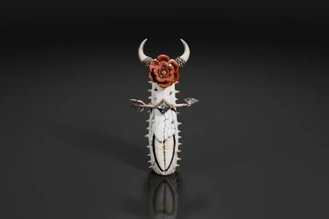 Photograph of a decorative object, which appears to be a dagger or a pendant 3D model preview