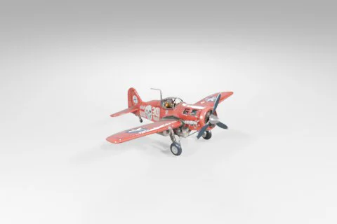 Small red biplane with a white stripe on the side 3D model preview