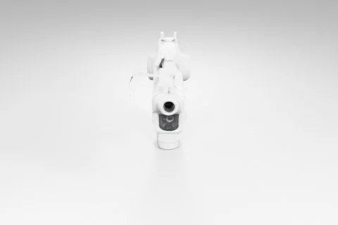Black and white photograph of a small robot-like object 3D model preview