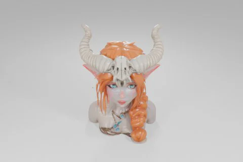 Small figurine of a woman with long orange hair and blue eyes 3D model preview